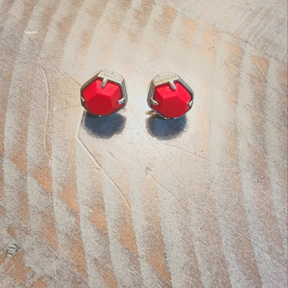 Kendra Scott silver and red earrings.